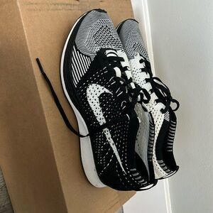 Classic black and white flyknit racers!